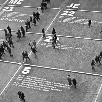 People lined up and waiting in front of a shop